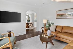 a living room with a couch and a table at 10th St Retreat in Boise +56 photos