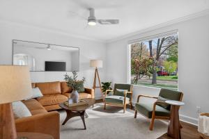 a living room with a couch and chairs at 10th St Retreat in Boise
