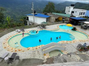 a group of people in a pool at a resort at Casa Lemora in Vergara