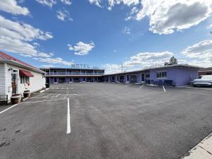 a parking lot in front of a motel at Purple Sage Motel in Panguitch