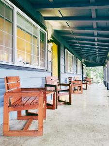 a row of benches sitting outside of a building at Fjordline Lodge in Hoodsport