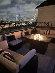 a living room with a couch and a table on a roof at The Grand Harris in Houston