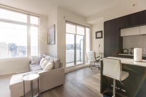 a living room with a couch and a table at Bisco Hill in Richmond Hill