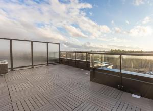 a balcony with a view of the water at Bisco Hill in Richmond Hill