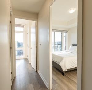 a bedroom with a bed and a large mirror at Bisco Hill in Richmond Hill