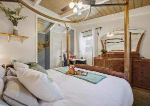 a bedroom with a bed and a large mirror at Bruno's Landing in Kansas City