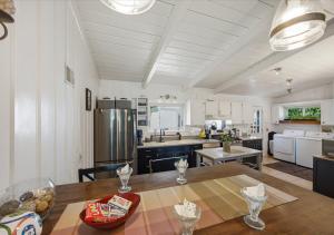 a kitchen with a wooden table and a large kitchen at Bruno's Landing in Kansas City
