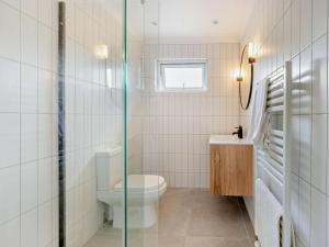 a bathroom with a toilet and a sink at 5 Bed in Dunbar oc-94334 in Dunbar +19 photos
