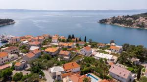 an aerial view of a town next to a body of water at Apartments and rooms by the sea Sumartin, Brac - 2953 in Sumartin