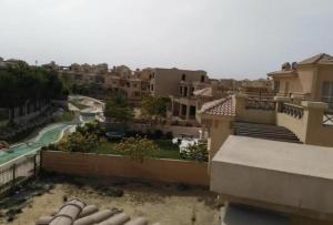 a view from the balcony of a apartment building at Katameya Palms in Cairo