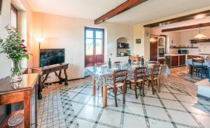 a dining room with a table and chairs at Villa Bricco Paglieri in Alba