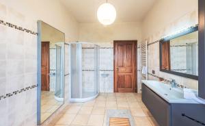 a bathroom with a shower and a sink and a mirror at Villa Bricco Paglieri in Alba +17 photos