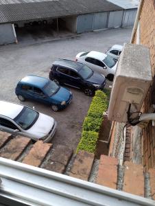 a group of cars parked in a parking lot at Apartamento em Pelotas Centro in Pelotas
