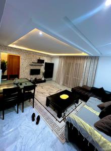 a living room with a ping pong table in it at Residance Panorama 52 in Sousse +11 photos