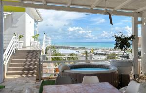 a patio with a view of the ocean at Villa Sara in Ragusa