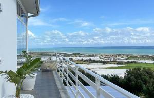 a balcony with a view of the ocean at Villa Sara in Ragusa