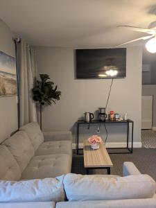 a living room with a couch and a table at Cottage & Garden in Jacksonville