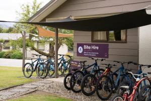 a group of bikes parked outside of a building at Tasman Holiday Parks - Wanaka in Wanaka