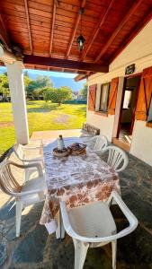 a table and chairs sitting on a patio at Cabañas Aldea Blanca in Merlo