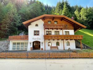 a house with a wooden roof at Haus Lina in See