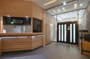 a lobby of a hospital with a sign on the wall at Daejeon Dunsan ING Hotel in Daejeon