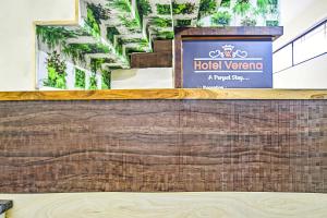 a sign for a hotel veranca on a wall at Collection O Verena in Indore +21 photos