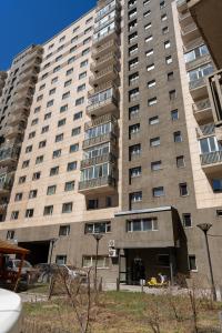a large apartment building with a large building at BNM Base Camp - Ulaanbaatar in Ulaanbaatar