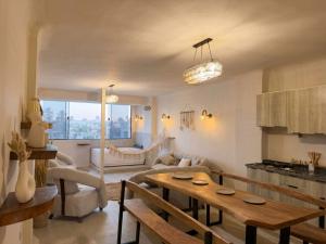 a living room with a table and a couch at nirvana pyramids view in Cairo