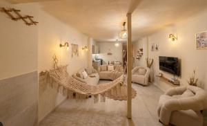a living room with a hanging hammock in a room at nirvana pyramids view in Cairo