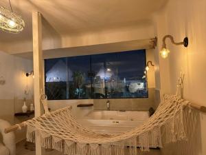 a swinging hammock in a bathroom with a tub at nirvana pyramids view in Cairo +76 photos