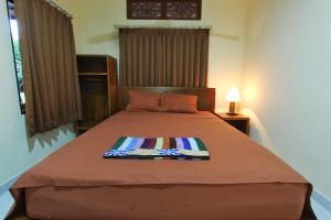 Кровать или кровати в номере Sensan House