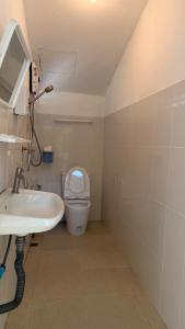 a bathroom with a sink and a toilet at Oasis2 Phuket Airport Glamping in Phuket +21 photos