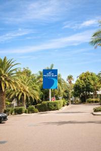 a blue sign in the middle of a road at Newly Restyled Resort 2 Bedroom Unit Oaks Pacific Blue in Salamander Bay