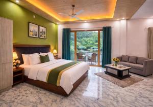 a bedroom with a large bed and a living room at Hotel MountMemory , Barkot-Yamunotri in Barkot