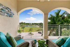a living room with a couch and a balcony at Spacious Condo - 2 King Suites - Close to Beaches in Marco Island