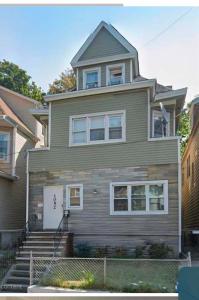 a large house with stairs in front of it at Grove 4- Queen bed with Private bathroom in Irvington