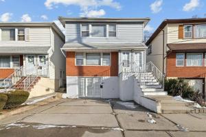 a house with a driveway in front of it at 16 sycamore rd in Bayonne
