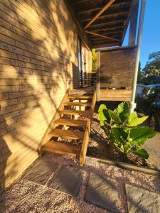 a wooden staircase on the side of a house at Saltwater Daze - Hosted in Sunshine Bay
