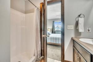 a bathroom with a shower and a sink at Poolside Retreat at Bridges Bay in Arnolds Park +27 photos