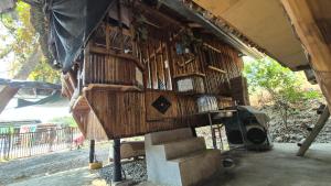 a bird house with stairs in a building at Rendan Kubo in Batangas City +10 photos