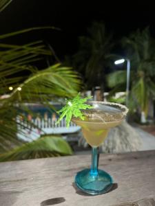 a drink in a glass sitting on a table at Tolu - Caribbean apartment in Santiago
