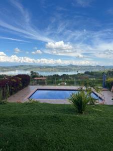 a swimming pool in a yard with a view of the water at Casa Africa in Calima