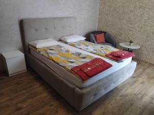 a bed with two pillows on it in a room at Apartment Moni 3 in Veliko Tŭrnovo