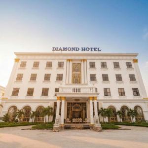 a large white building with a sign on top of it at Diamond Hotel Bỉm Sơn Thanh Hóa in Bỉm Sơn