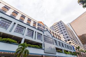 a building in the city with tall buildings at Club Dolphin Hotel in Kuala Lumpur