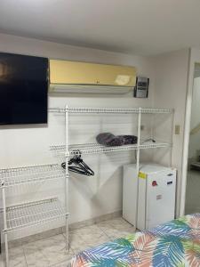 a room with a bunk bed and a white closet at JARDIN DE TEQUENDAMA HOTEl in Cali