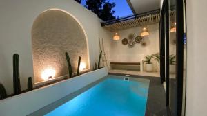 a swimming pool in the middle of a house at Numar Villas Yogyakarta in Seturan