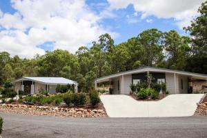 a house with a driveway in front of it at Boonah Valley Motel in Boonah