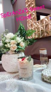 a table with a vase with flowers on it at Speranza's Sweet Home, Family House with Garden in Vrontantos in Vrontádos +35 photos