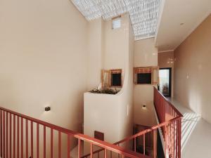 an attic staircase with a skylight in a house at XOM House Biển Hồ in Bien Ho